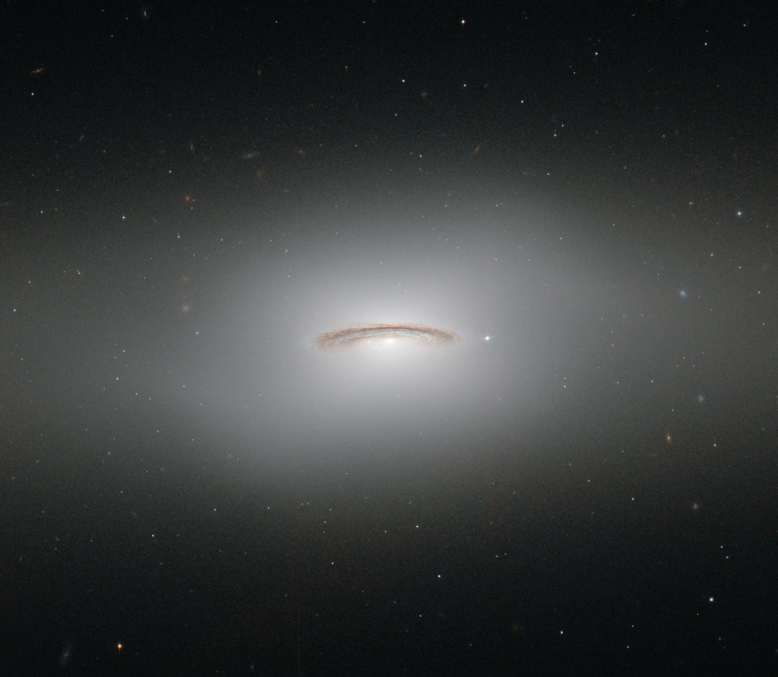 a colossal supermassive black hole is hiding in the center of NGC 4526 galaxy